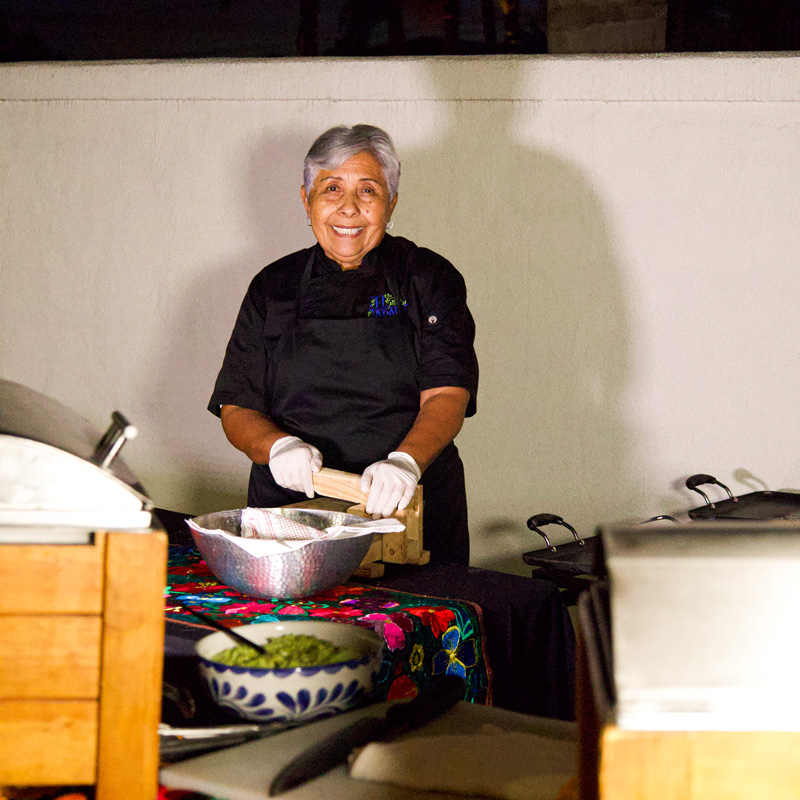 lady smiling cooking food